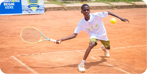 A player hitting a forehand on a clay court