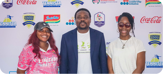 Organisers in front of the tournament backdrop