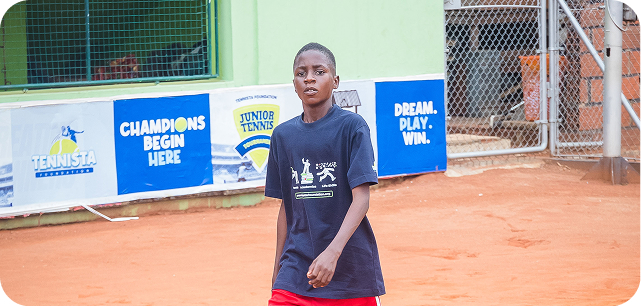 A player standing on a clay court