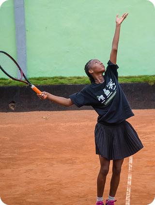 A player tossing the ball to serve