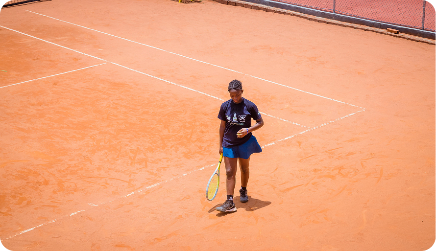 A player walking across a clay court