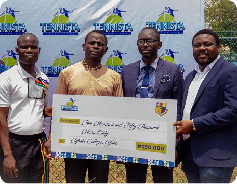 A scholarship cheque presented in front of a Tennista backdrop