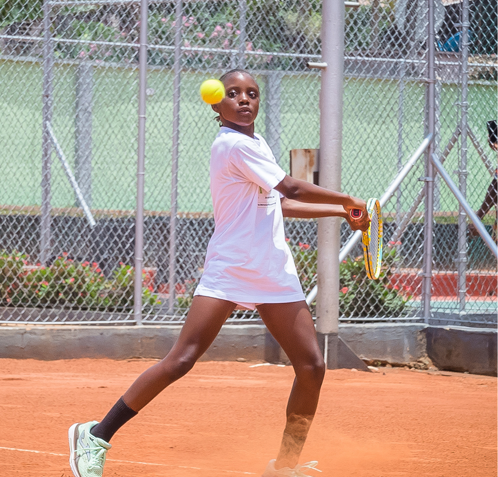 A player hitting a forehand on a clay court